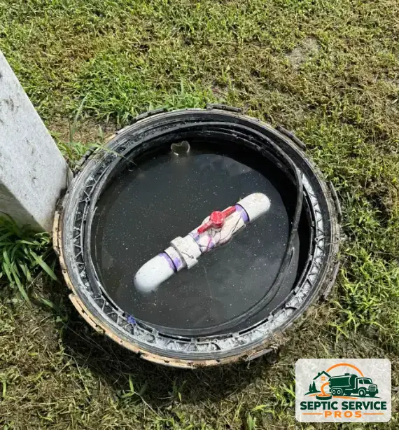Check valve on the discharge pipe inside a septic pump tank riser