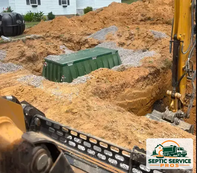 Plastic septic tank set on gravel in an excavation before backfill